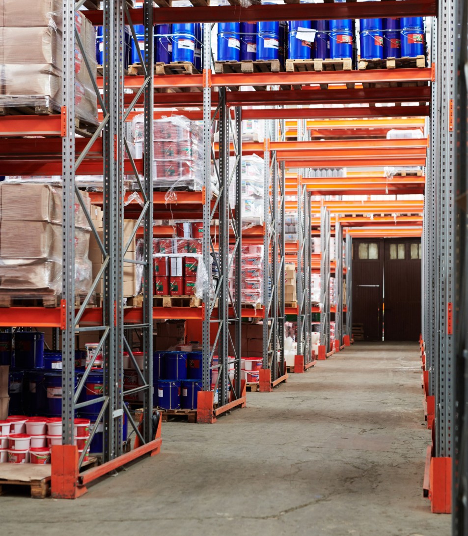 Warehouse forklift moving stacked plastic pallets